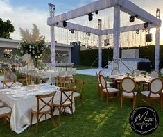 an outdoor event set up with tables and chairs