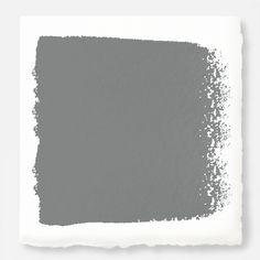 a white square with some gray paint on it's side and the color is light grey