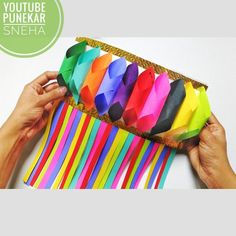 a person is holding a box with many different colored paper items in it and the text below reads youtuber pnekar sneha