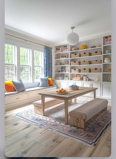 a living room filled with furniture and lots of bookshelves next to a window