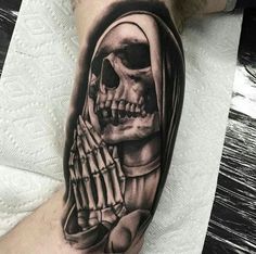 a person with a skeleton tattoo on their arm