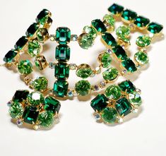 "Huge Emerald Rhinestone Bracelet Earring Set High End This Bracelet Earring Set was recently used in a Photo Shoot, See 2nd Picture Necklace Not for Sale. Here it is Ladies The Most Gorgeous, Shiny Gold tone set with Glorious Emerald Rhinestones, Peridot and Icy AB Rhinestones. Definitely a Designer Set, attributed to Schreiner. Bracelet 7\" x 2\" with chain guard and secure clasp. Matching 1 1/2\" x 1\" Earrings Gorgeous Pristine Condition! Unsigned You'll be the Envy of your Friends with this One!" Picture Necklace, Walmart Jewelry, Jewelry Advice, Butterfly Jewelry, Rhinestone Bracelet, Pricing Jewelry, Designer Earrings, Pandora Charm Bracelet, Amazing Jewelry