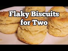 flaky biscuits for two on a plate with the words flaky biscuits for two