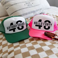 Celebrate turning forty in style with our Hello Forty trucker hat! This trendy and fun hat is perfect for the birthday squad looking to make a statement at the big celebration. Whether you're hitting the town with friends or having a low-key gathering, this hat is sure to add a touch of flair to your birthday outfit. Made with high-quality materials, this hat is comfortable and durable, making it the perfect accessory for your special day. Stand out from the crowd and show off your birthday spirit with our Hello Forty trucker hat! ⦿ QUANTITY: Sold individually. ⦿ MATERIAL: 100% Polyester front; 100% Nylon Mesh back. ⦿ SIZING: One size fits most; Plastic adjustable strap. ⦿ CARE INSTRUCTIONS: Spot clean as necessary (with care around the printed design). ⦿ FEATURES: Crown measures approxima Birthday Girl Hat, Hello Forty, Turning Forty, Hat Birthday, Fun Hat, Welcome Bags, Mount Pleasant, Birthday Hat, Cool Hats