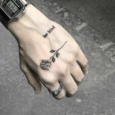 a person's hand with a tattoo on it