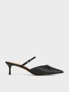 These all-black kitten-heel mules will transition seamlessly from day to night. With a classic pointed-toe silhouette, they offer a streamlined and polished aesthetic that will work well for both the office and evening events. The simple and clean design allows the gem bow details on these shoes to shine in the spotlight -- they will add a touch of sparkle to any look. In addition, the kitten heels prioritise comfort and wearability, so you can wear these all day with ease. Sleek High Heel Mules For Formal Occasions, Sleek Black Kitten Heels For Evening, Sleek High Heel Formal Mules, Sleek Kitten Heels With Sculpted Heel For Night Out, Black Modern Kitten Heels For Formal Occasions, Modern Black Kitten Heels For Formal Occasion, Elegant Mules With Sculpted Heel For Night Out, Sleek Evening Kitten Heels With Padded Heel, Modern Black Formal Kitten Heels