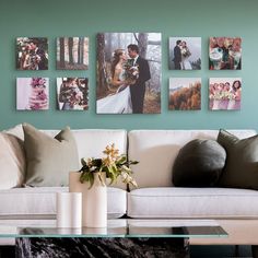 a living room filled with furniture and pictures hanging on the wall above a coffee table