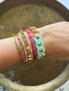 Festival, concerts, outdoor parties in the park - these are the bracelets you will need to complete your look! Accent your arms with this set of Bohemian Bling - a colorful grouping of bracelets that are entirely handmade with all types of fun details. What's more - you can wear them individually or group them in a myriad of ways! Buy them now! Or read further... A. Uptown/Downtown Bracelet: A friendship bracelet in shades of pink and lime green, backed with a yellow suede,  and adjustable lengt Pink Beaded Bracelets For Spring Festival, Spring Festival Pink Beaded Bracelets, Pink Bracelets For Summer Festivals, Pink Bracelet For Summer Festival, Green Bracelets For Spring Party, Adjustable Bracelets For Party Festival, Adjustable Bracelets For Party And Festival, Handmade Bracelets For Party And Festival, Pink Bangle Beaded Bracelets For Festivals