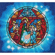 the birth of jesus is depicted in this cross - stitched pattern on blue fabric