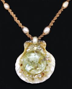 "This pendant is a real seashell that's been filled with genuine mother of pearl, abalone, and a small sand dollar that's been sealed under glass. The necklace is hand braided hemp with freshwater that is adjustable, when fully closed it measures 18\" ... when fully open it measures 24\" in length making it easy to slip over one's head." Ocean-inspired Abalone Shell Gift, Mother Of Pearl Shell Strand As Gift, Mother Of Pearl Shell Strand Gift, Ocean-inspired Mother Of Pearl Shell Necklace As Gift, Ocean-inspired Mother Of Pearl Shell Necklace For Gift, Ocean-inspired Mother Of Pearl Shell Necklace Gift, Handmade Shell-shaped Pearl Necklace, Handmade Shell-shaped Pearl Necklace Gift, Handmade Shell-shaped Pearl Necklace For Gift