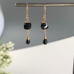 "Black Earrings, Dainty Earrings, Gemstone Earrings, Gold Earrings, Women Earrings, Gift for Mom, Gift for Sister, Black and Gold, Black Jewelry When you want to dress up your outfit with the perfect balance of understated glamour, this earring is for you. The faceted Black Spinel Cubes and beautiful tear drops brings to any outfit that perfect hint of sophistication. To add a little bit of contrast we capped the black spinel cube with beautiful beads caps. Each of the stone in these feminine ea Green Amethyst Earrings, Feminine Earrings, Hamsa Bracelet, Gemstone Earrings Gold, Tear Drops, Gift For Sister, Women Earrings, Earrings Dainty, Earrings Women