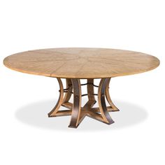 a round wooden table with four leaves on it