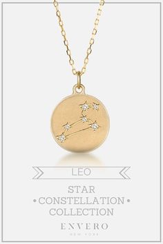 a gold necklace with the zodiac sign and stars on it, in front of a white background