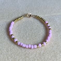 - One Of A Kind Beaded Charm Bracelet - Featuring Pink And Gold Seed Beads - Gold Colored Hardware - Clasps Closed. No Stretch. - Size/ Circumference Is 7” - Handmade (By Myself). Perfect To Treat Yourself Or To Give As A Unique Gift! **Add 2 Jewelry Items Marked “2 For $20” To Your Bundle And I Will Send You An Offer For $20** Check Out The “Boutique” Tab In My Closet For Handmade Earrings, Bracelets, And Necklaces! Adjustable Pink Beaded Bracelet With Spacer Beads, Pink Gold Beads For Jewelry Making, Pink And Gold Beads For Jewelry Making, Pink Bracelets With Gold Beads For Beach, Adjustable Pink Beaded Bracelets With Gold Beads, Gold Bead Bracelets, Gold Beads, Handmade Earrings, Womens Jewelry Bracelets