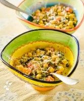 two bowls filled with food on top of a table