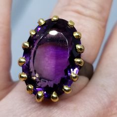 This Fun Genuine Amethyst Ring Boasts 24 Carats, And Makes For A Nice Sized Ring. Not Too Big, Not Too Small. It's Set In Solid 925 Sterling Silver Which Has Been Plated With Both Yellow Gold And Black Rhodium. Artisan Handmade Size 9 Stamped 925 Genuine Natural Gemstones Luxury Faceted Amethyst Ring For Formal Occasions, Luxury Faceted Amethyst Ring For Formal Events, Oval Amethyst Collectible Ring, Faceted Purple Amethyst Ring For Formal Occasions, Luxury Amethyst Ring Gift, Formal Faceted Purple Amethyst Ring, Handmade Amethyst Ring In Yellow Gold, Purple Faceted Ring For Formal Occasions, Formal Faceted Amethyst Ring Fine Jewelry