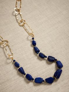 Lapis Link Necklace | Aureus + Argent | Banana Republic Factory Gold Lapis Lazuli Faceted Beads Necklace, Gold Lapis Lazuli Necklace With Faceted Beads, Blue Beaded Brass Necklaces, Gold Lapis Lazuli Jewelry With Polished Beads, Gold Lapis Lazuli Necklaces For Jewelry Making, Gold Necklace With Lapis Lazuli Gemstone Beads, Gold Necklaces With Lapis Lazuli Gemstone Beads, Gold Lapis Lazuli Necklace With Gemstone Beads, Raw Stone Necklace