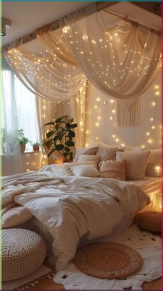 a bedroom with lights on the walls and a bed covered in white sheets, pillows and blankets