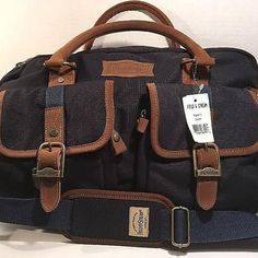 This Is A Navy Blue Fabric With Brown Leather Trim Travel Bag With Detachable Padded Shoulder Strap By Field & Stream! Condition: Brand New With Tags. Please Note: *There Is A Small Area Of Lightening To The Fabric On The Bottom From Apparent Shelf Wear, Really Not Significant.* Features: Dimensions: 16"L, 12"H, 4"W Hand Carry Leather Straps And Additional Detachable Padded Fabric Shoulder Strap Padded Removable Pouch, Good For Protecting Smaller Electronic Devices D500/12 Casual Brown Travel Bag With Top Carry Handle, Navy Rectangular Bags For Weekend Trips, Casual Brown Shoulder Bag For Weekend Trips, Blue Bags With Pockets For Weekend Trips, Brown Bags With Top Carry Handle For Weekend Trips, Brown Bag With Top Carry Handle For Weekend Trips, Casual Navy Bags With Leather Handles, Navy Satchel Bags With Leather Handles, Large Luggage