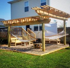 a backyard area with hammock and deck