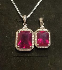 Stunning Ruby Deep Red Gem Rectangular Cut, Silver Necklace, Choice Of 10x12mm, OR, 8x10mm Lab Created Simulated Ruby, See Video Of 8x10mm! 925 Sterling Silver Cubic Zirconia Trimmed Pendant, Rhodium Plated, 18" Sterling Chain. Gift Box Included. Red Rectangular Stone Jewelry For Gifts, Red Rectangular Stone Jewelry Gift, Formal Red Square Pendant Necklace, Fine Jewelry With Red Rectangular Stone, Red Rectangular Sterling Silver Jewelry, Cubic Zirconia Octagon Necklace For Gift, Cubic Zirconia Octagon Necklace As Gift, Rectangular Red Sterling Silver Jewelry, Cubic Zirconia Necklace Gift