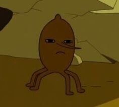 a cartoon character sitting in the middle of a desert