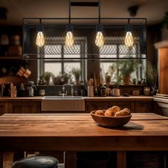 a wooden table topped with a bowl of food under two hanging lights over a kitchen island