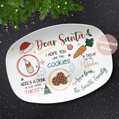 a white oval platter with the words dear santa written in different languages on it