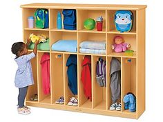 Our super-accessible center lets little ones hang up coats and backpacks all by themselves! It features storage space for up to 8 children, with 8 big cubbies on top that are roomy enough for diaper bags, blankets and more�plus 8 easy-access lockers below, all with rounded wooden pegs to keep children safe. Center measures 58"w x 13 3/4"d x 49"h. Daycare Cubbies, Preschool Cubbies, Kids Locker, Home Lockers, Coat Storage, Storage Center, Lakeshore Learning, Cubby Storage, Flexible Seating