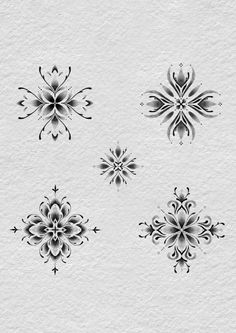 four black and white floral designs on a piece of paper with watermarking in the middle