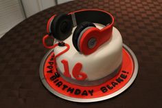 a birthday cake with headphones on top