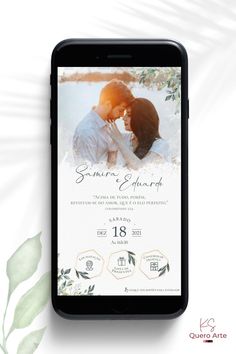 an iphone screen with the wedding announcement on it and greenery leaves in the background