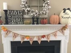 a fireplace mantle decorated with fall decorations