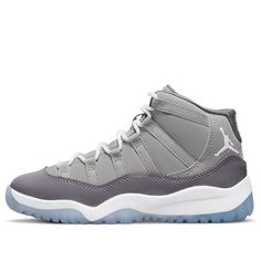 The Air Jordan 11 Retro PS ‘Cool Grey’ is a scaled-down edition made for little kids, faithful to the original 2001 release. It features a grey nubuck upper with tonal webbing lace loops and a glossy patent leather overlay. Branding hits include a Jumpman logo embroidered on the lateral ankle and ‘23’ stamped on the back tab. The lightweight tooling comprises a white Phylon midsole and translucent rubber outsole. (SNKR/AJ11/High Top/Basketball) High Top Air Jordans, Jordan 11 Cool Grey, Grey Jordans, Jumpman Logo, Air Jordan 11 Retro, Jordan 11 Retro, Air Jordan 11, Grey Sneakers, Jordan 11