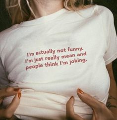 a woman wearing a t - shirt that says i'm actually not funny, i'm just really mean and people think i'm looking