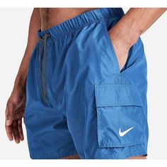 Men's Nike Packable Cargo Volley 5-Inch Swim Shorts Blue Size Extra Large Size & Fit Regular Fit For All-Day Comfort 5" Inseam Product Features Elasticized Waistband With Drawcord For Adjustable Fit Zippered Rear Pocket, Drop-In Hand Pockets And Cargo Pocket At Left Thigh For Plenty Of Storage Rear Pocket Converts Into Bag So You Can Pack These Trunks And Go Fabric Blend Machine Wash The Nike Packable Cargo Volley 5-Inch Swim Shorts Are Imported. You'll Never Be Caught Without Your Swimwear When Nike Swim, Cargo Pocket, Man Swimming, Swim Trunks, Men's Nike, Swim Shorts, Large Size, Nike Men, Extra Large