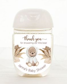 a baby shower bottle with a teddy bear on it's label that says, thank you for showing our little bear