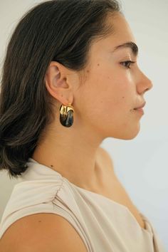 PRODUCT DESCRIPTION If you are a fan of Complete. Studio. You would know Amber Hoop Earrings are our all-time best sellers. Same style, but a brand new color is now landed as a lot of our customers request black! Elevate your look with the sleek sophistication of our Inkwell Kira Earrings. Statement Hoop Earrings Water Resistant 18k Gold-plated on High-quality brass Acrylic 3.6cm in height 3.2cm in width Weight: 12-14g for each Read our full Jewellery Care Guide here Read our Sizing Guide here Trendy Black Clip-on Earrings As Gift, Chic Black Metal Earrings, Trendy Black Everyday Earrings, Modern Black Hoop Earrings For Party, Chic Black Earrings With Black Enamel, Trendy Black Clip-on Earrings, Black Drop Earrings For Everyday, Trendy Black Pierced Hoop Earrings, Everyday Black Drop Earrings