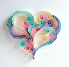 a paper heart with swirls and circles on the inside is cut out to look like an abstract painting