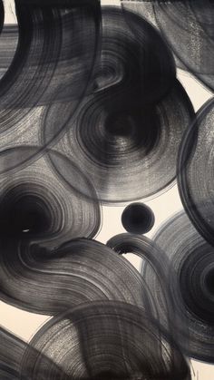 an abstract black and white painting with circles