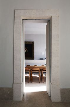 an open door leading into a dining room