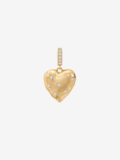 You know you have a heart of gold and now everyone else will know too! This shiny gold heart charm features small crystal stones strategically placed on the surface of the heart for maximum sparkle. The light reflects off the stones and the gold at every moment. The connector piece also features crystal stones that create the ultimate sparkle, shine, and love trio. This charm is ideal for use on the Memories Base Pearl Necklace.- Gold plating over brass- Cubic zirconia- Available in Yellow Gold Gold Heart Pendant Jewelry With Sparkling Stones, Gold Heart Jewelry With Diamond Accents, Gold Heart-shaped Jewelry With Sparkling Stones, Heart-shaped Gold Jewelry With Sparkling Stones, Gold Heart Necklace With Diamond Accents, Gold Pearl Necklace, Crystal Stones, Gold Heart, The Memories