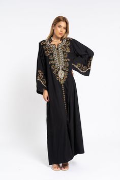 This stunning kaftan with its monotone embroidery will be your summer favorite. It is an extremely comfortable wear, light and soft and can be used on many occasions -  home gatherings, festival parties, summer occasions, dinners, or just in your home to feel comfortable.  Fabric : 70% Egyptian Cotton and 30% Polyester Sizes : The dress comes in two sizes. S/M/L which fits up to a size 14 US (Large) and one that fits up to a size 22 US (2XL). It comes with a cinch in the back to accentuate your Traditional Embellished Dress With Kimono Sleeves, Traditional Embellished Kaftan With Kimono Sleeves, Embellished Kaftan With Kimono Sleeves For Eid, Eid Embellished Kaftan With Kimono Sleeves, Floor-length Resham Embroidered Kaftan, Festive Embroidered V-neck Thobe, Flowy Maxi-length Abaya For Eid, Embellished Kaftan For Festive Vacation, Festive Embellished Kaftan For Vacation