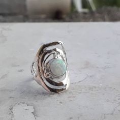 Great comfortable fit White opal silver ring, Statement ring for women inspired by the harmony that exists in spring. Gift for women, holiday accessories, Gift for mom. Boho ring made of sterling silver 925. Looking like a drop of water that fell from the sky and landed in a puddle, it's the most magical harmony in nature. Material: Sterling silver Gemstone: White opal stone. Size to order: 5-16 U.S 🔸 All my creations made by me from Fine Materials, Gemstones, high quality. 🔸 Unique Technique Silver Opal Ring Gift, Spiritual Silver Opal Ring Birthstone, Silver Spiritual Opal Birthstone Ring, Silver Round Opal Ring, Harmony In Nature, Opal Statement Ring, White Opal Ring, Ring Opal, Hammered Earrings