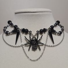 Handmade, black spider beaded choker necklace with lobster clasp. All necklaces come on a bookmark for reduced waste! A small microfiber cloth will also be included for polishing. Spider Accessories, Gothic Jewelry Diy, Gothic Spider, Black And White Necklace, Black And White Necklaces, Spider Necklace, Shiny Jewelry, Y2k Jewelry, Stone Choker