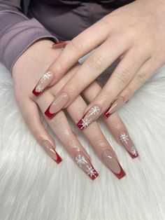 red winter nails, snowflake nails, red french tips, winter nail inspiration, christmas nail inspo Winter Nails Red Snowflake, Demure Christmas Nails, Red Snow Flakes Nails, Red French With Snowflake Nails, Coffin Xmas Nails, Green And Red French Christmas Nails, Winter Red Nails Design, Coffin Winter Nail Ideas, Red French Tip Nails Snowflake