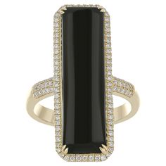 Elegant and exquisitely detailed 14 Karat Yellow Gold Ring, center set with 7.62Cts .Octagon Shape Black Onyx, and micro pave set Diamonds, weighing approx. 0.365Cts Beautifully Hand crafted in 14 Karat Yellow Gold. Stone Detail: Black Onyx: 28x8MM Stone Weight: Black Onyx: 7.62Cts Diamond: GH/SI Total Diamond weight: 0.365Cts Indian Gifts, Octagon Shape, Black Ring, Yellow Gold Ring, Jewelry Ring, Micro Pave, Black Rings, Yellow Gold Rings, Black Onyx