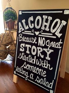 a sign that says alcohol because no great story started with someone eating a salad on the table