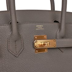 This Birkin is in Etain togo leather with gold hardware and has tonal stitching, front flap, two straps with center toggle closure, clochette with lock and two keys, and double rolled handles.The interior is lined with Etain chevre and has one zip pocket with an Hermes engraved zipper pull and an open pocket on the opposite side.Collection: UOrigin: FranceCondition: New and never worn (Plastic on hardware)Accompanied by: Hermes box, Hermes dustbag, clochette, lock, two keys, clochette dustbag, f Birkin 30, Hermes Birkin 30, Hermes Box, Togo Leather, Sierra Leone, Casual Backpack, Hermes Birkin, Gold Hardware, Givenchy