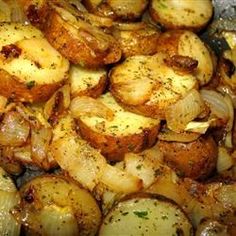 cooked potatoes and onions in a pan with seasoning